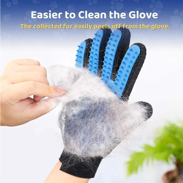 Hand peeling fur off a black and blue grooming glove.