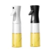 Two oil sprayers, one white and one black, filled with yellow oil on a white backdrop.