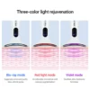 White beauty device demonstrating three-color light therapy with blue, red, and violet modes for skin rejuvenation.