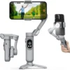 Smartphone mounted on a 3-axis gimbal with a person and child in the background on the phone screen.