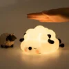 Sheep nightlight with hand demonstrating touch activation.