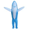 Front view of blue inflatable shark costume with arms raised.